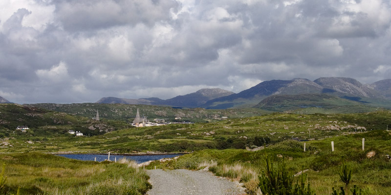 The spires of Clifden, and the mountains known as the Twelve Bens, in the distance.