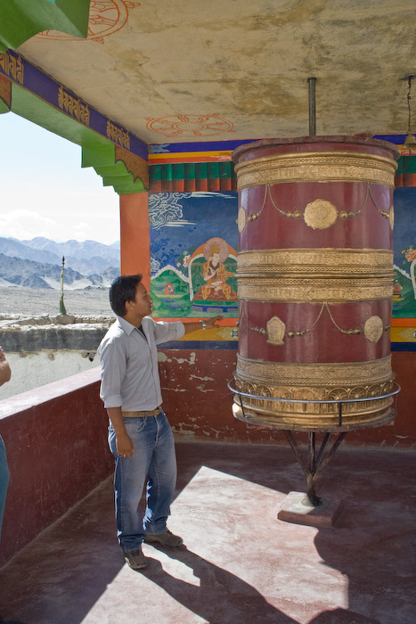Dorje, our guide for the day, explains the meaning of the prayer wheel