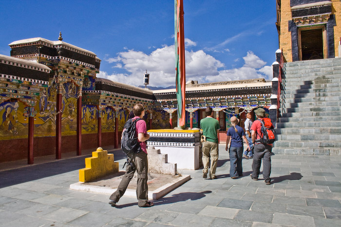 The group in the courtyard about to enter the main chamber of the gompa (up the stairs)
