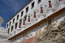 Thiksey - wall carvings along the side of the gompa